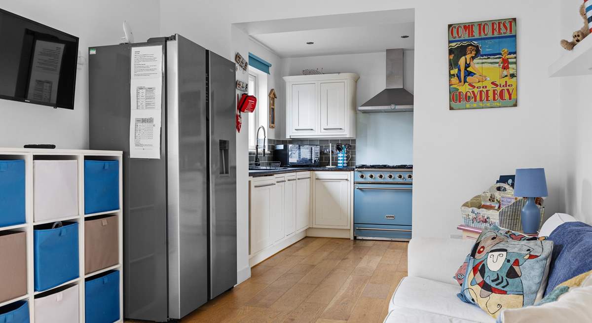 The kitchen is next to the children's playroom.