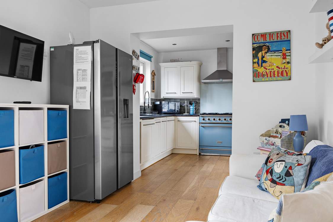 The kitchen is next to the children's playroom.