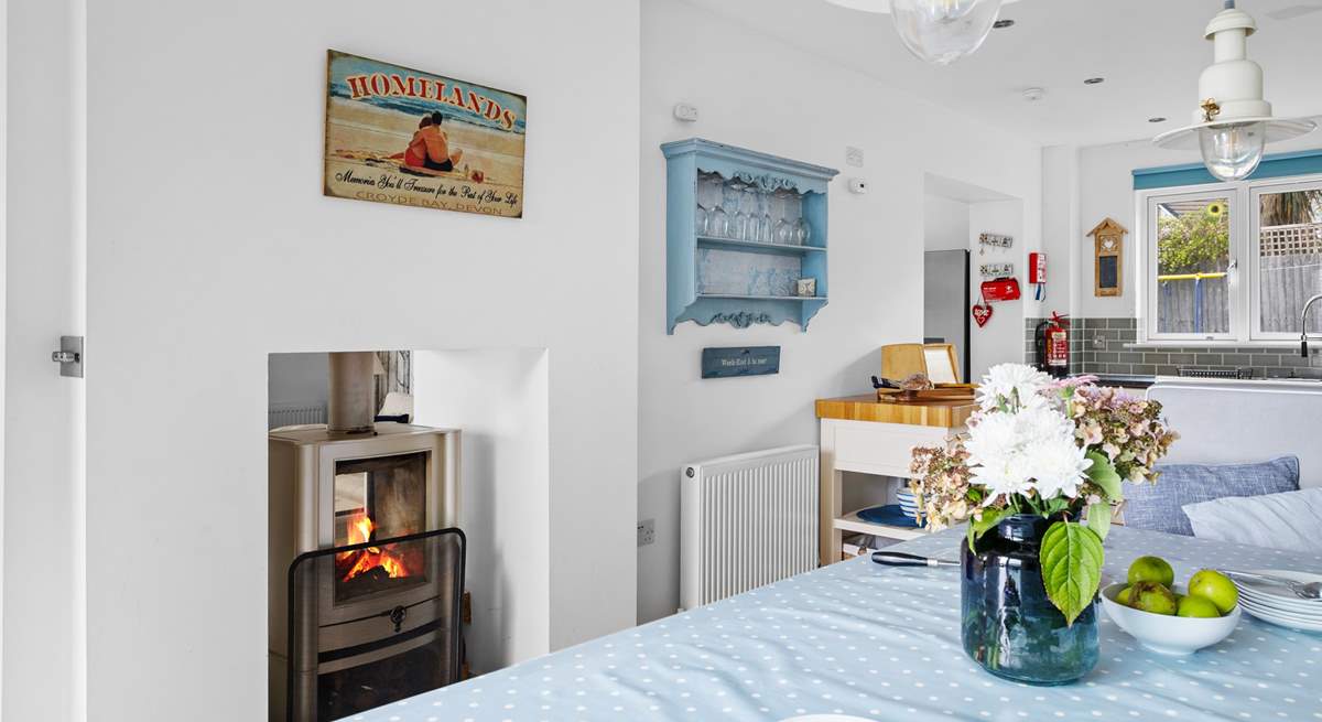 The fire warms both the sitting and dining areas. 