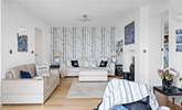 Relax on the sofas and watch a movie on the Smart TV. - Thumbnail Image