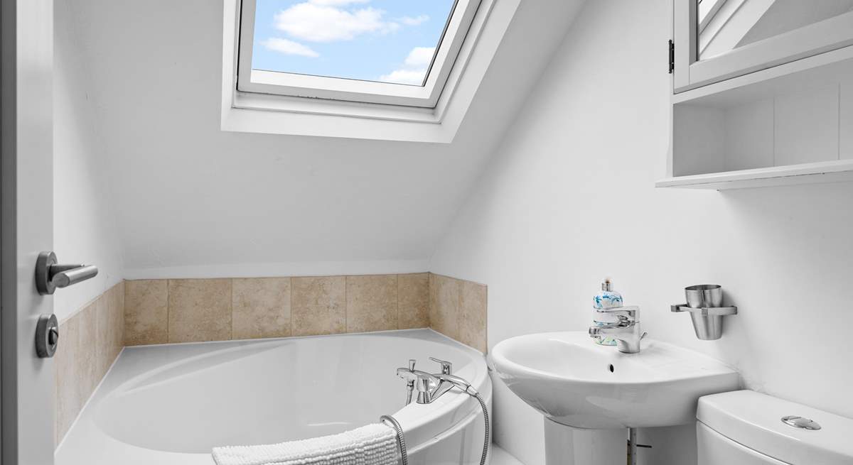 Enjoy a relaxing soak in the corner bath.