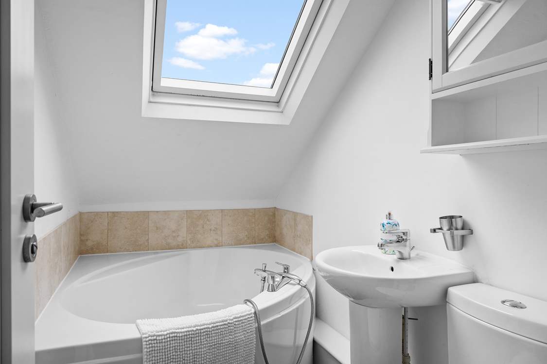 Enjoy a relaxing soak in the corner bath.