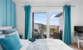Open the patio doors and take your morning coffee outside. What a fabulous room to enjoy the views from. - Thumbnail Image