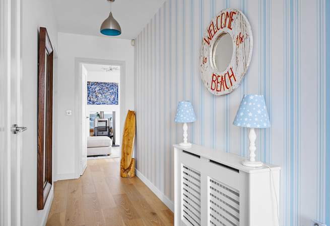 Follow the hall to find the stairs leading up to all of the bedrooms.