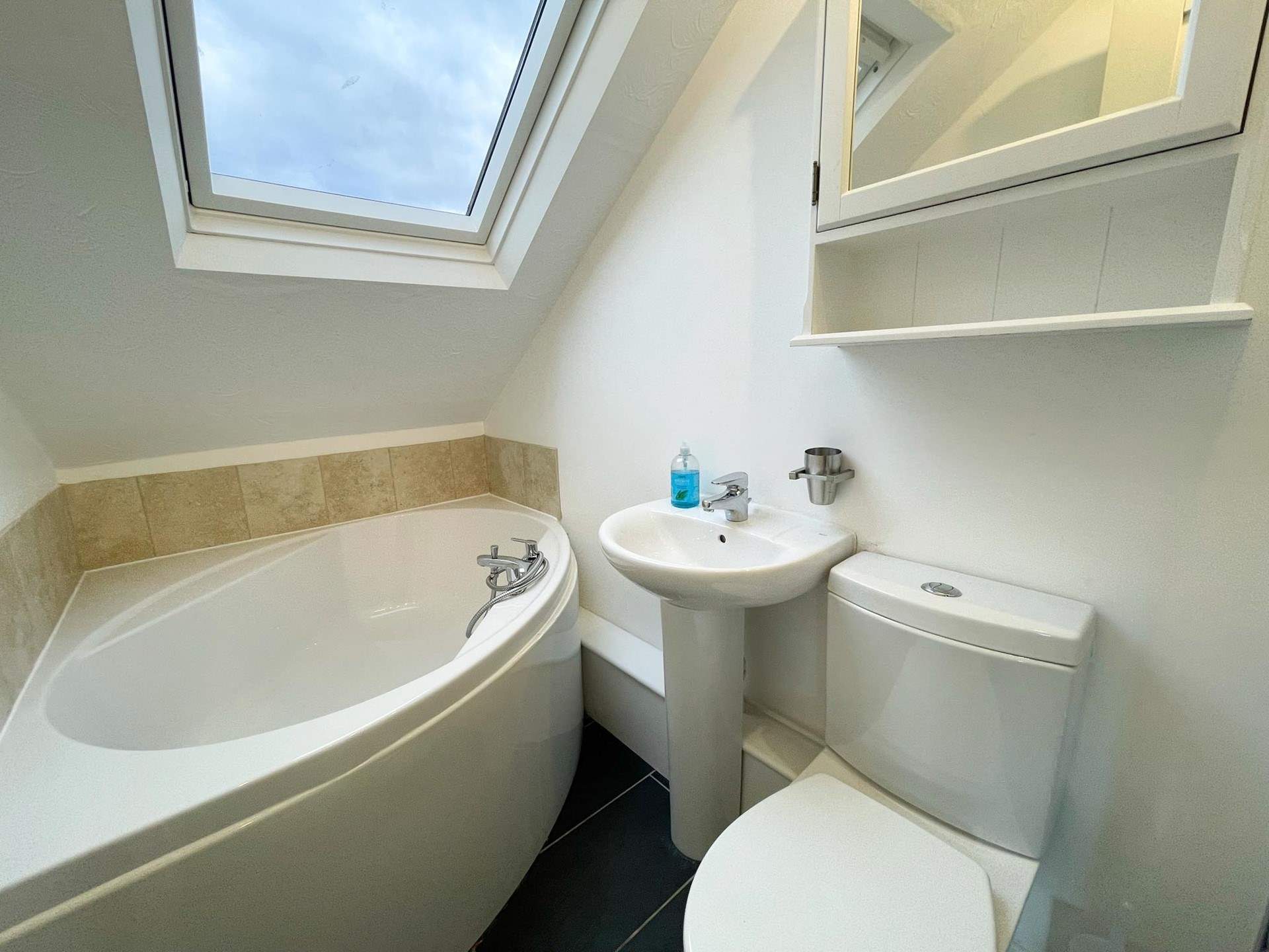 Enjoy a relaxing soak in the corner bath.