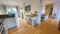 Just off of the kitchen you will find the perfect sofa to enjoy a morning coffee whilst the children play. You can even open the patio door on to an enclosed area where the children and dog can play.
