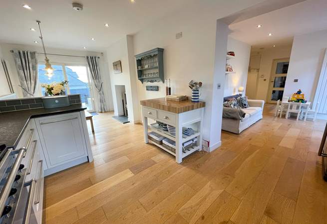 Just off of the kitchen you will find the perfect sofa to enjoy a morning coffee whilst the children play, you can even open the patio door on to an enclosed area for play and your hound.