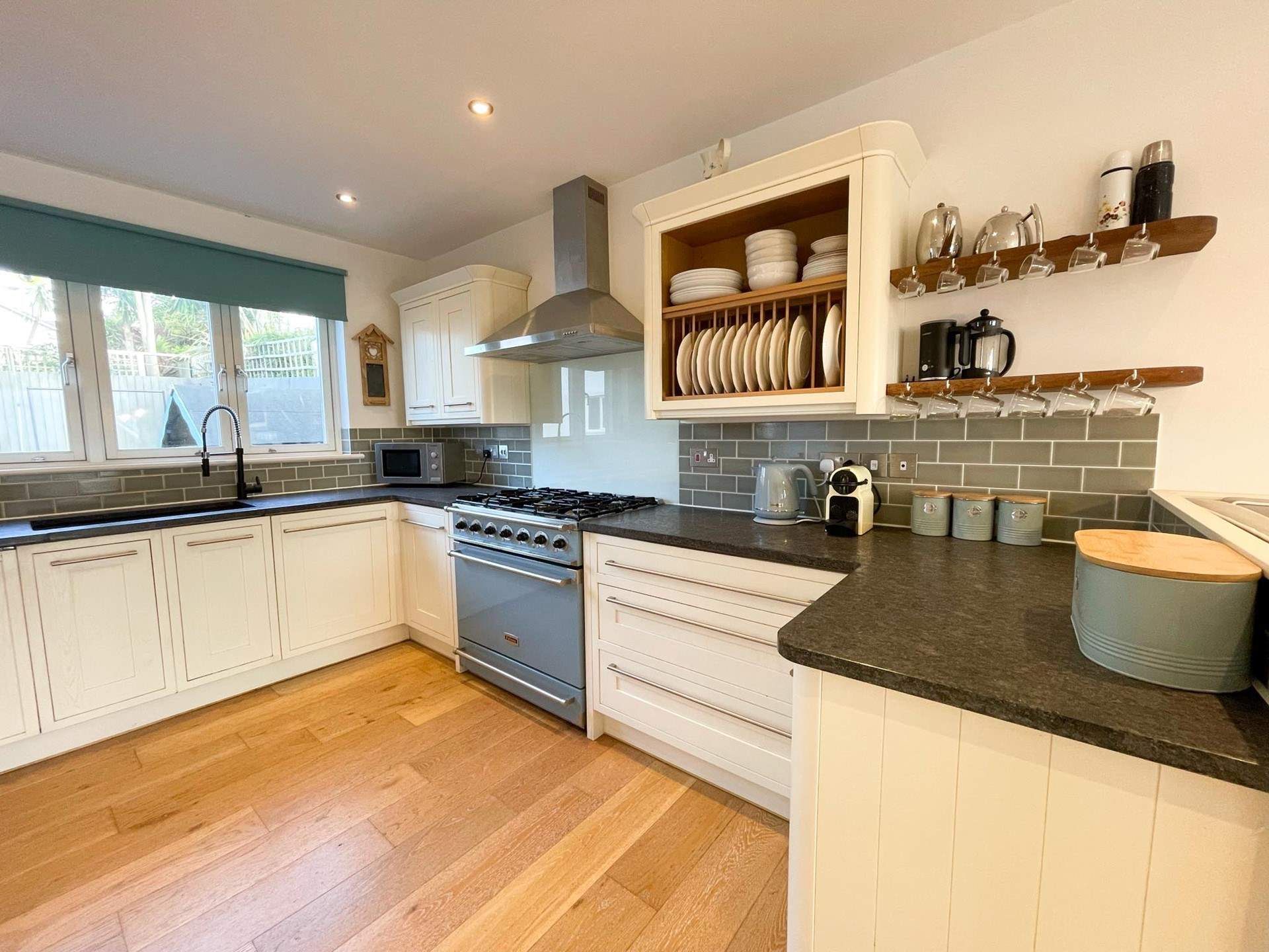 The kitchen sits to the back of the house and has all the equipment you'll need.