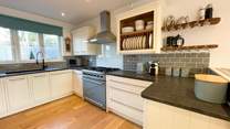 The kitchen sits to the back of the house and has all the equipment you'll need.