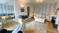 Homelands has so much space to offer. The Smart TV can be found opposite the L shape sofa.