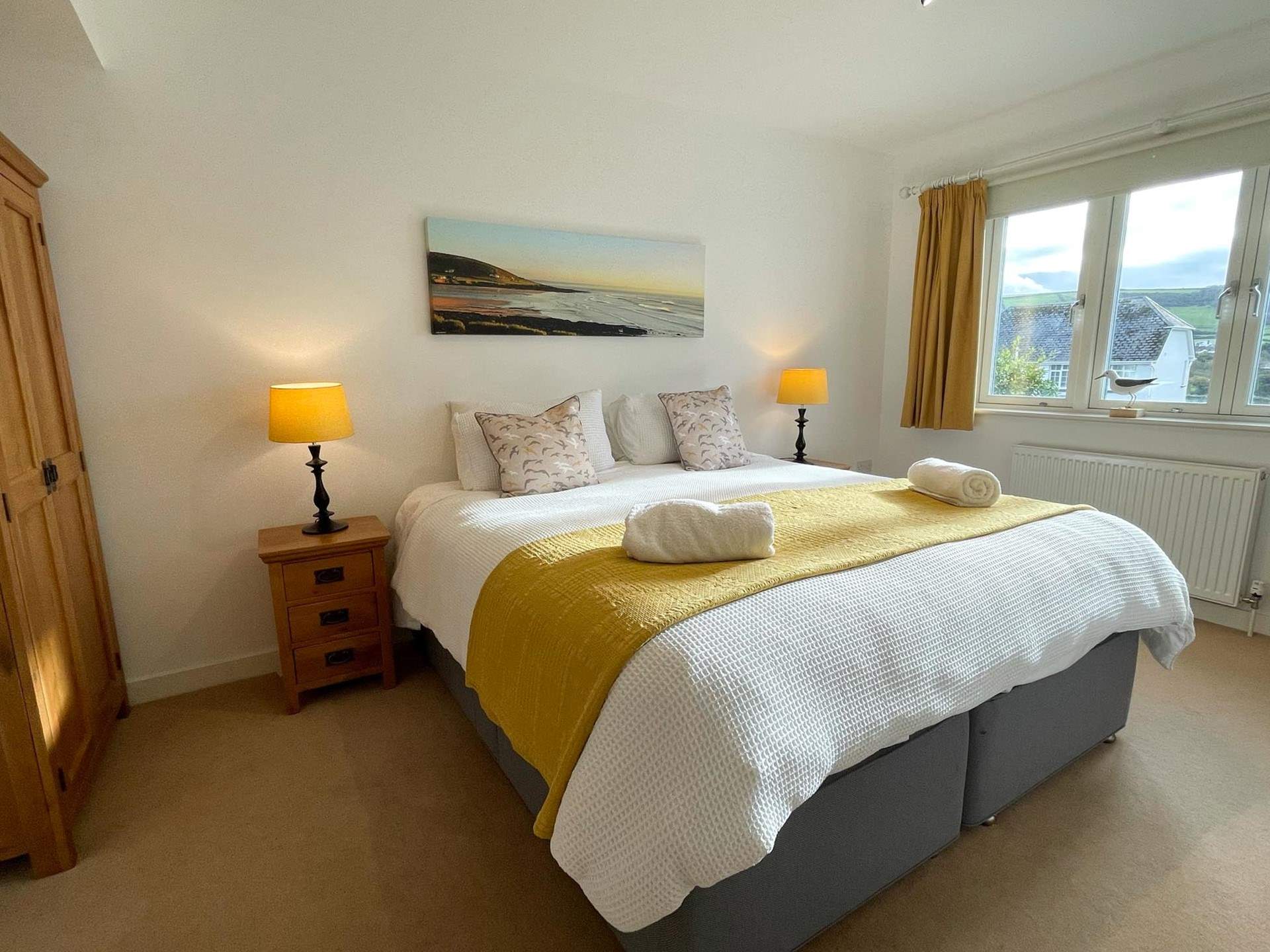 The main bedroom has an en suite and glorious views of the beach.