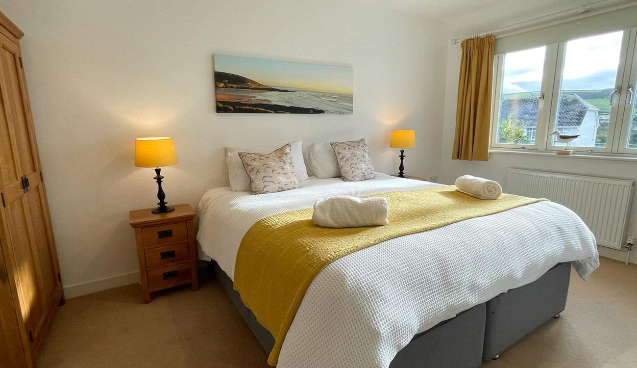 The main bedroom has an en suite and glorious views of the beach.