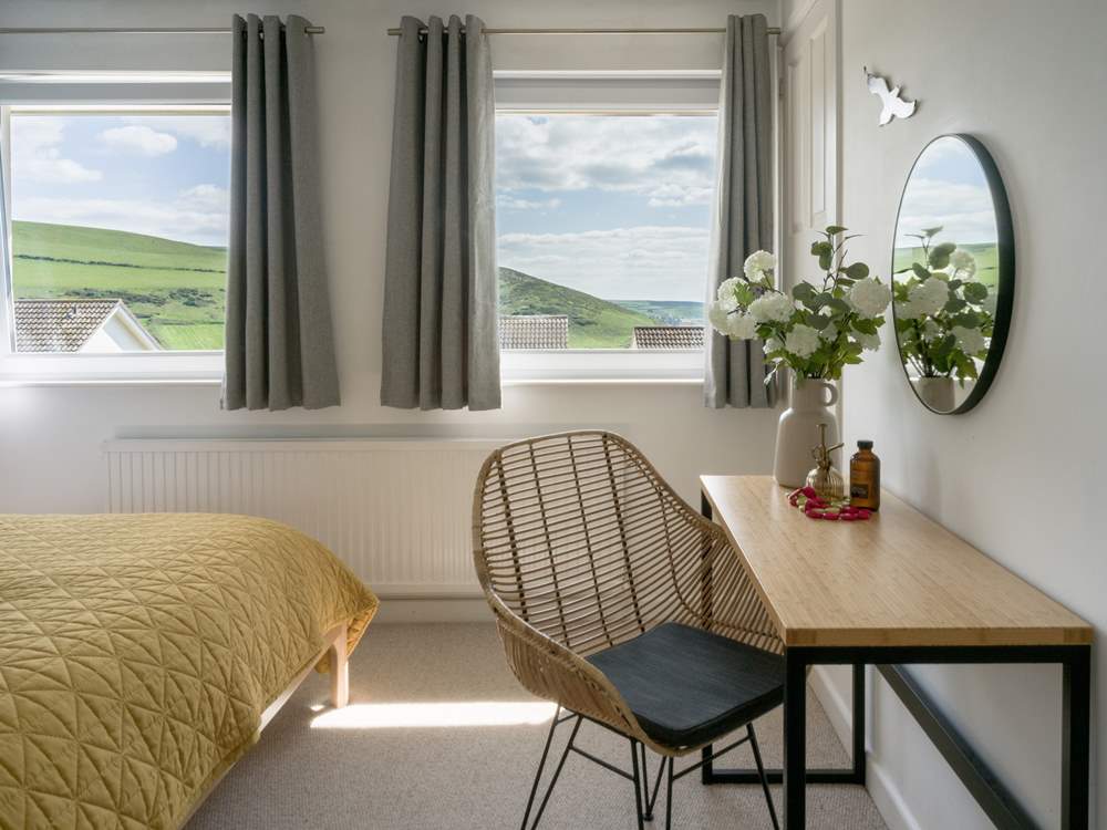 A bedroom with coast views.
