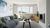 Contemporary furnishings welcome you into the first floor sitting-room. 