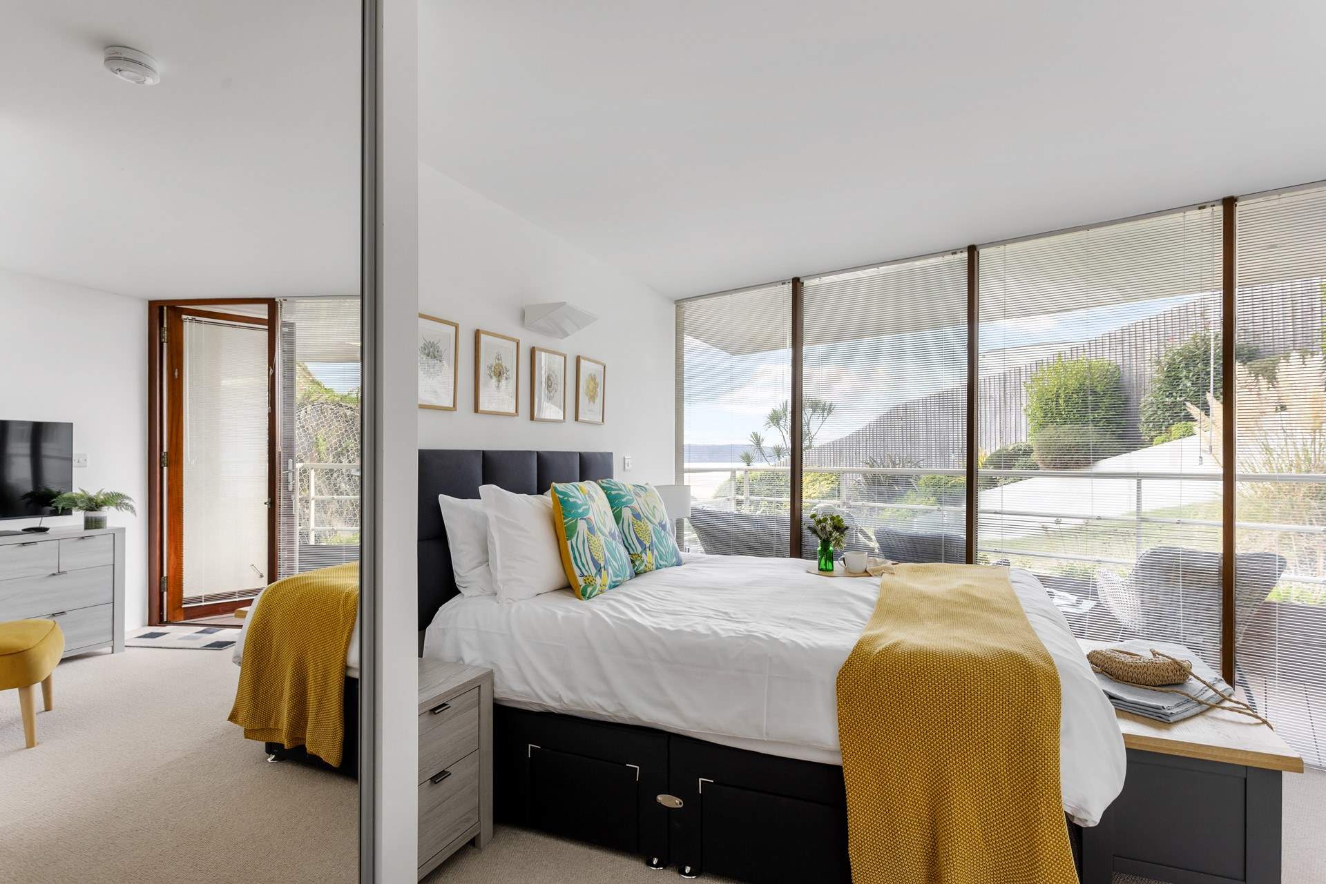 The bedrooms are beautifully furnished. This is bedroom 1 with access to the balcony. 