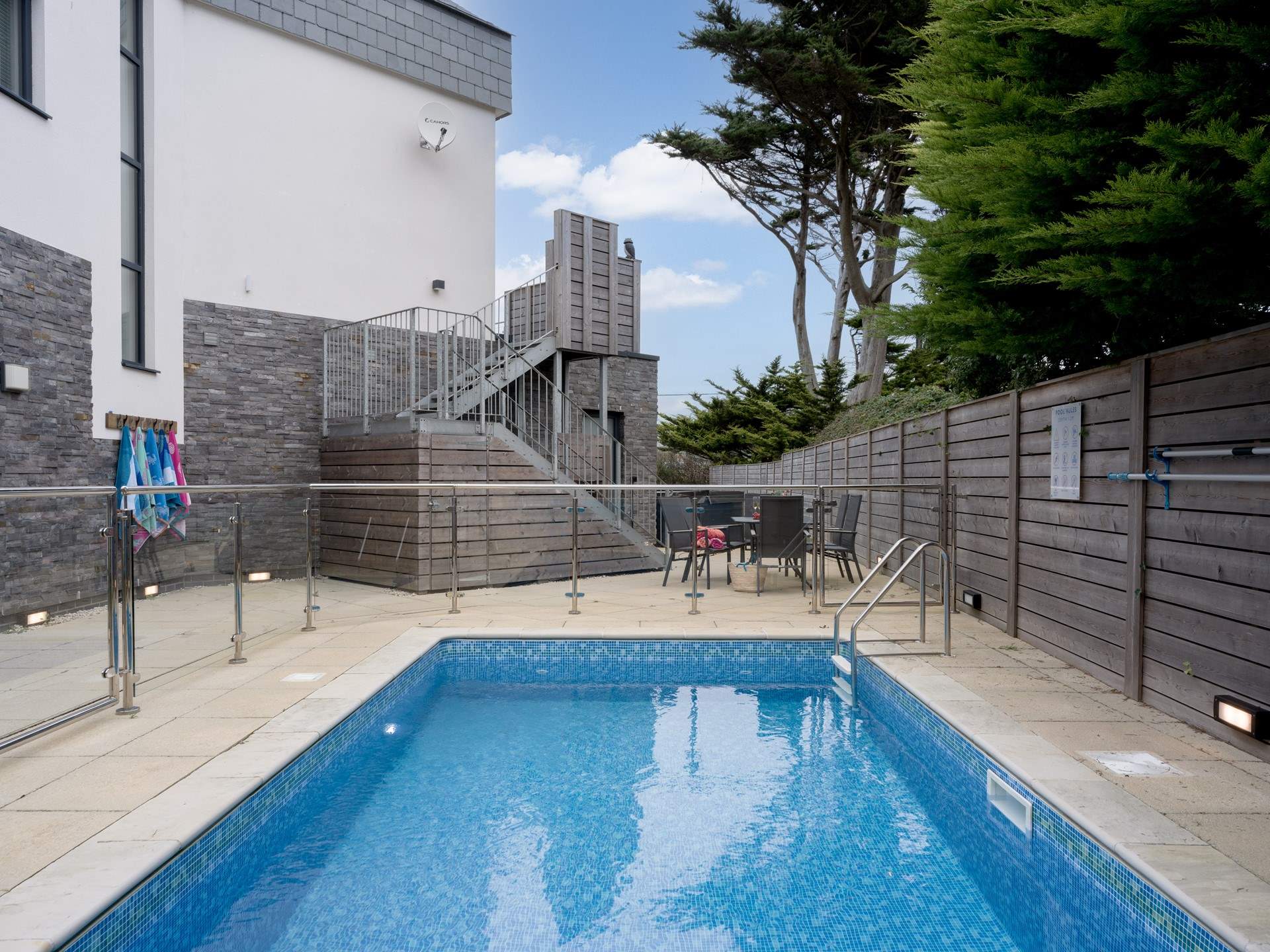 It has its very own swimming pool and hot tub!