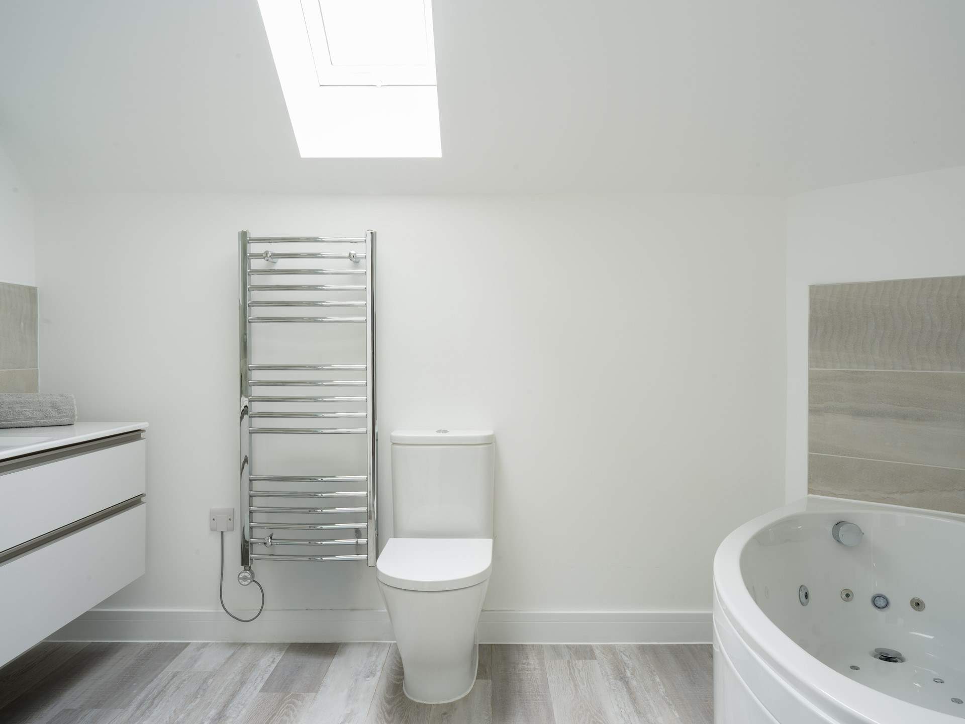 To a luxurious soak in the Jacuzzi bath after surfing the waves.