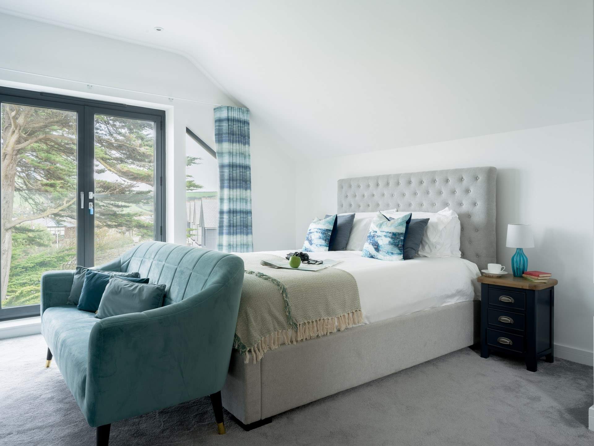 This beautiful principal bedroom offers the feeling of a hotel suite.