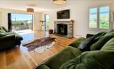 Contemporary furnishings await in the spacious sitting-room.  - Thumbnail Image