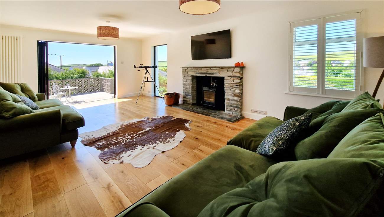 Contemporary furnishings await in the spacious sitting-room.