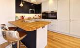 Perch at the breakfast bar and chat with the chef.  - Thumbnail Image