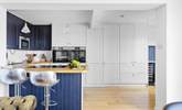 Perch at the breakfast bar and chat with the chef.  - Thumbnail Image