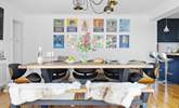 Gather everyone around the table to chat about the adventures of the day.  - Thumbnail Image