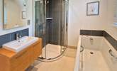 The family bathroom has a bath and shower cubicle. - Thumbnail Image