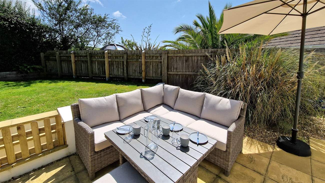 Enjoy the garden in the Devonshire sunshine whilst the children and family dog play on the lawn.