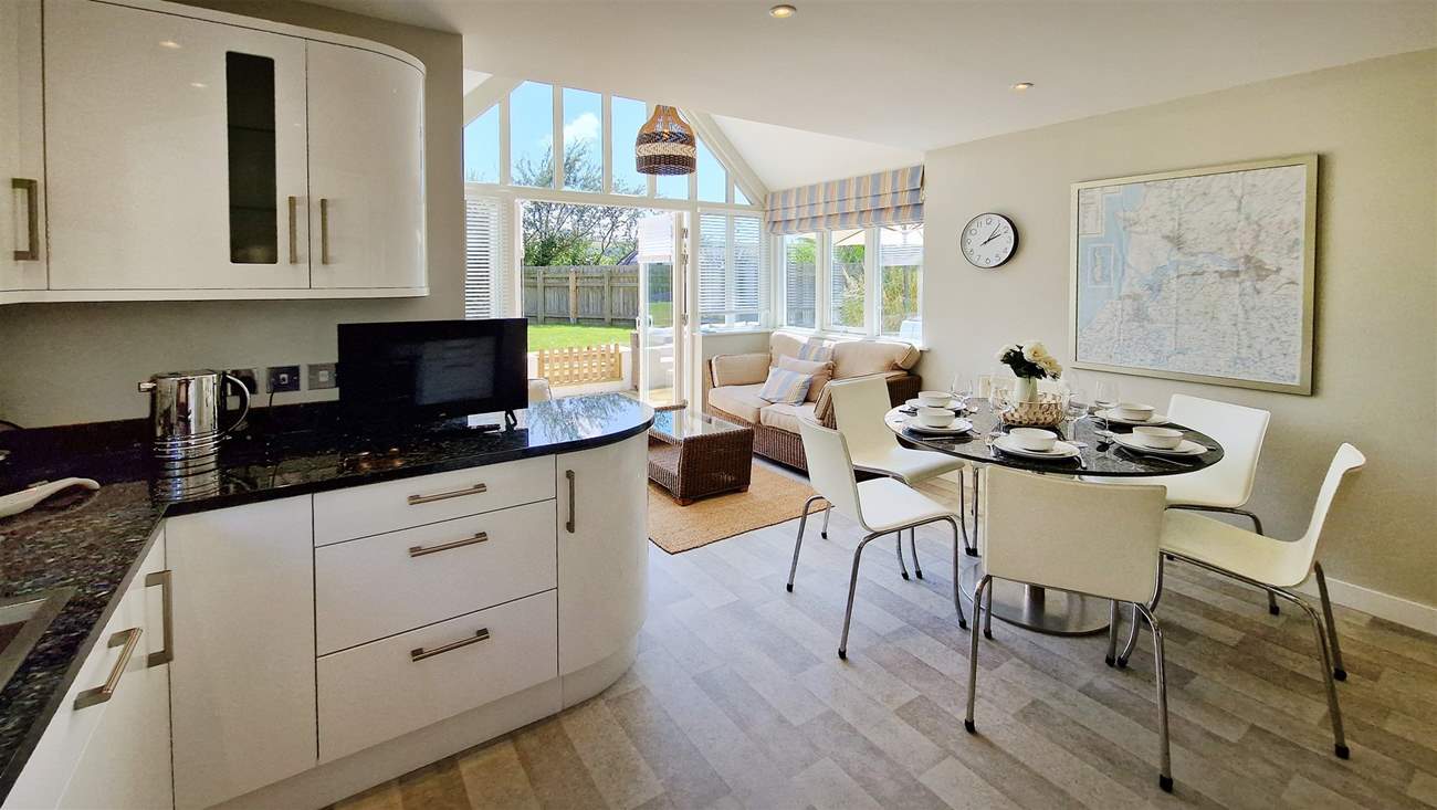 The fabulous kitchen/diner has doors French leading to the garden.