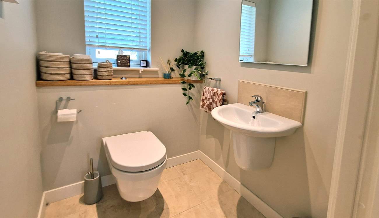 The handy ground floor cloakroom. 