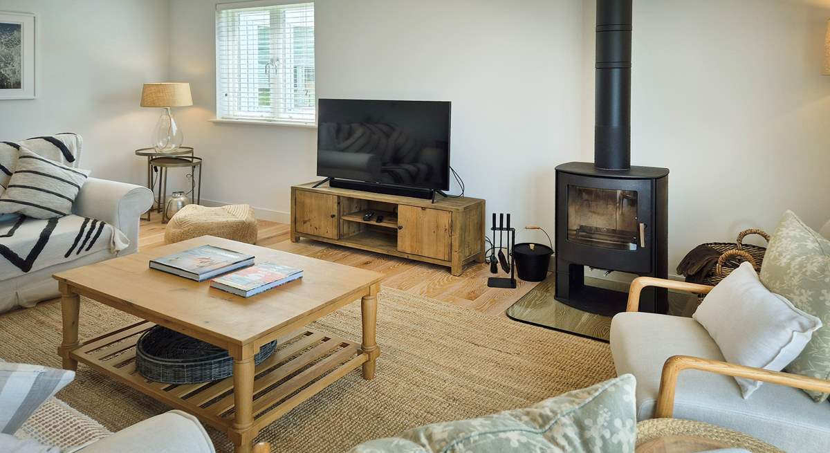 Beautifully furnished throughout, this is the cosy sitting-room.