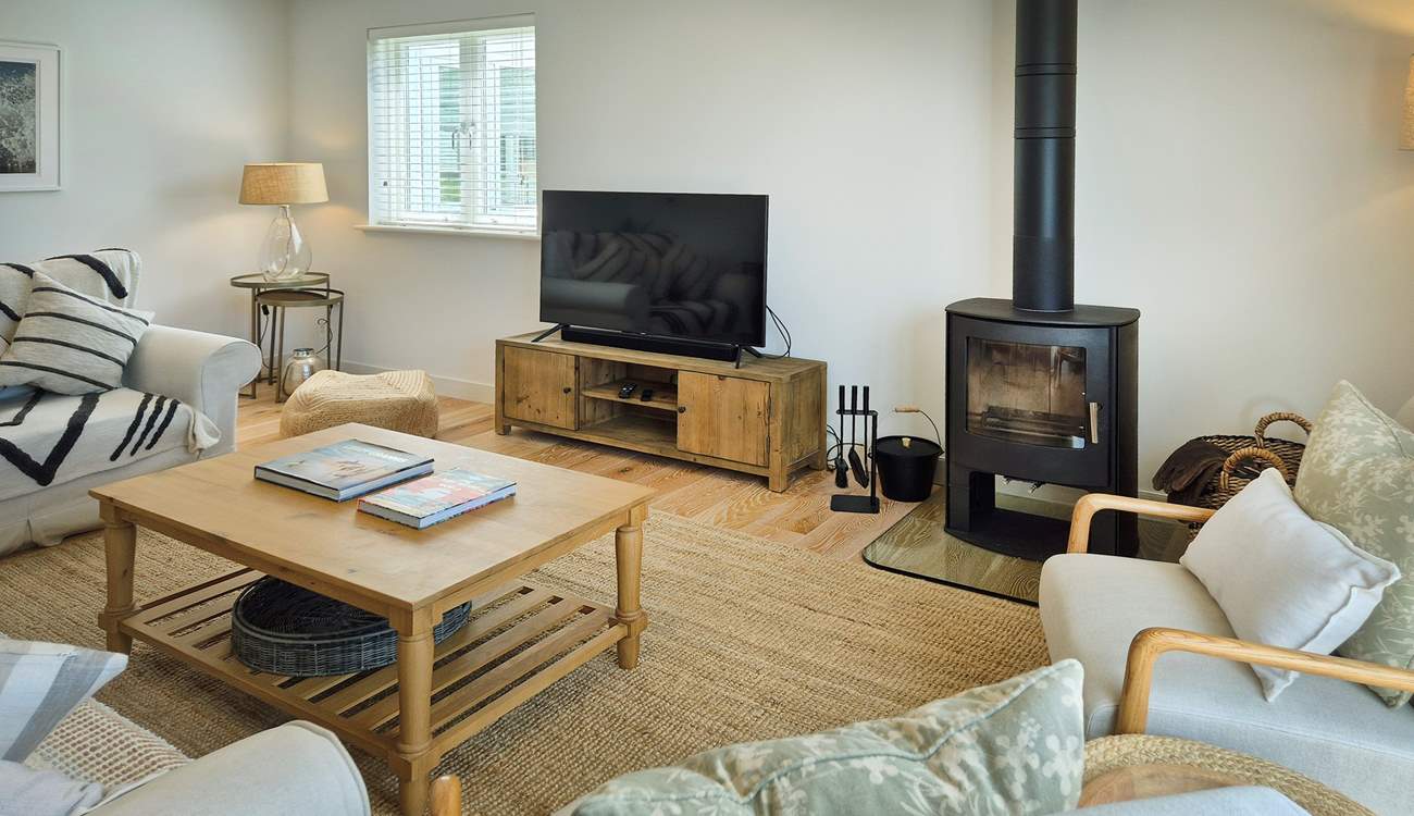 Beautifully furnished throughout, this is the cosy sitting-room.