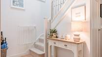 Head upstairs to the bedrooms are on the first floor. 