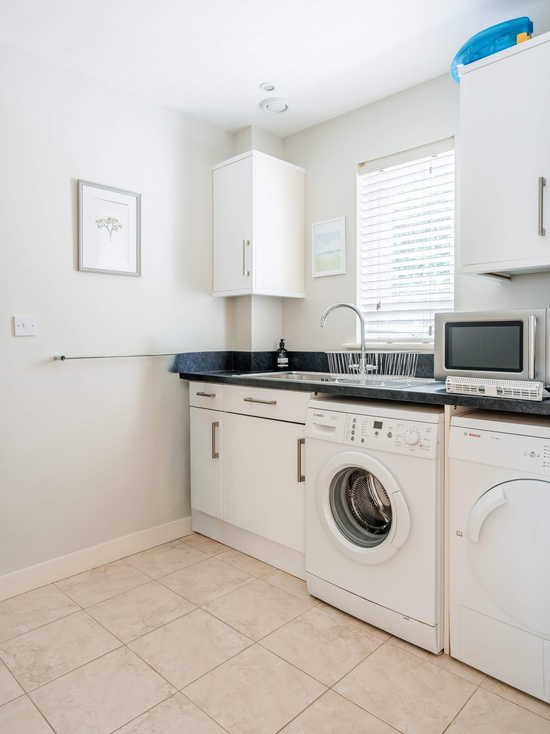 No need to take your dirty laundry home with all these facilities in the utility-room.