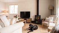 Warm your toes (or paws) by the wood-burner.