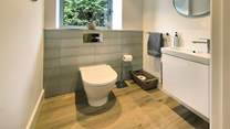 The ground floor cloakroom is accessed through the utility-room.