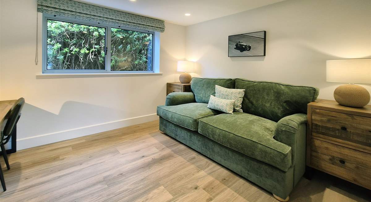 The cosy snug is the perfect space to unwind or catch up on some work.