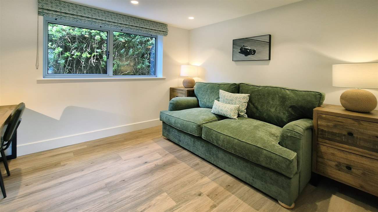 The cosy snug is the perfect space to unwind or catch up on some work.