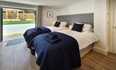 Bedroom one is a twin room with double doors leading out to the garden. - Thumbnail Image