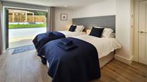 Bedroom 1 can be either a twin or super-king room with double doors leading out to the garden.