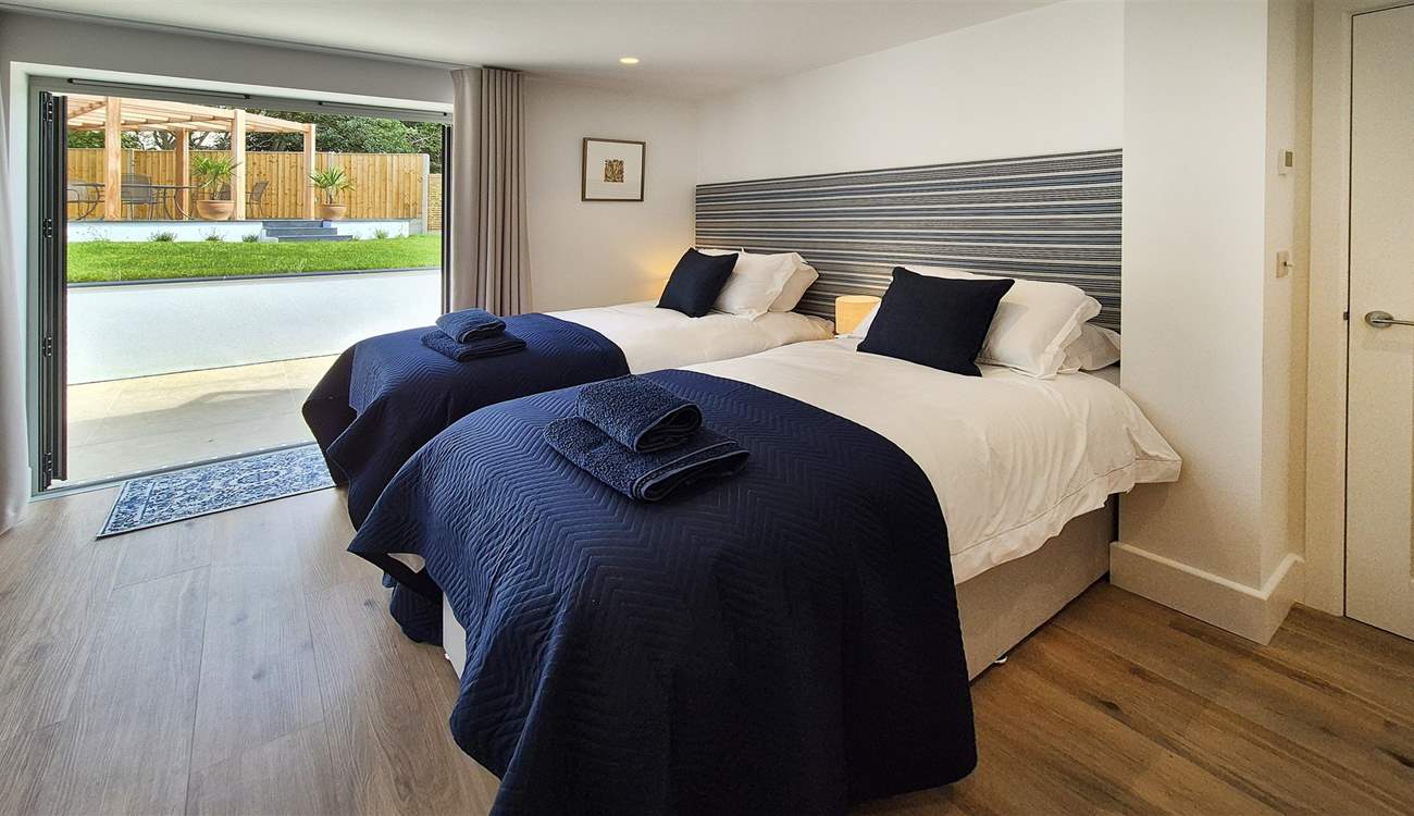 Bedroom 1 can be either a twin or super-king room with double doors leading out to the garden.