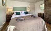 Bedroom two is a stylish king room. - Thumbnail Image