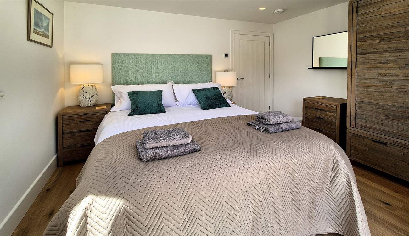 Bedroom 2 is a stylish room with a king-sized bed.