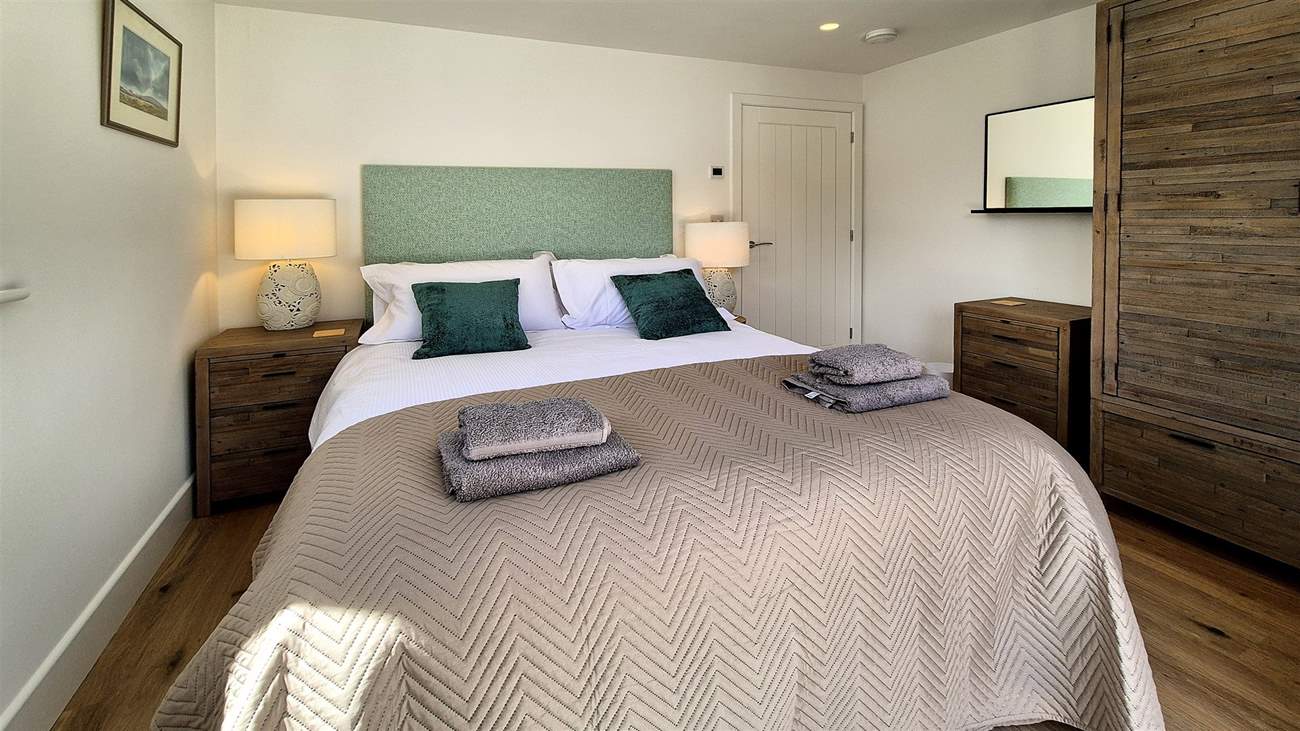 Bedroom two is a stylish king room.