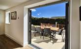Soak up the sunshine from the patio. - Thumbnail Image