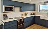 The kitchen has everything you might need for mealtimes. - Thumbnail Image