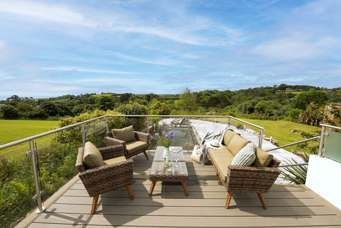 Share a glass of wine and admire the far reaching views.