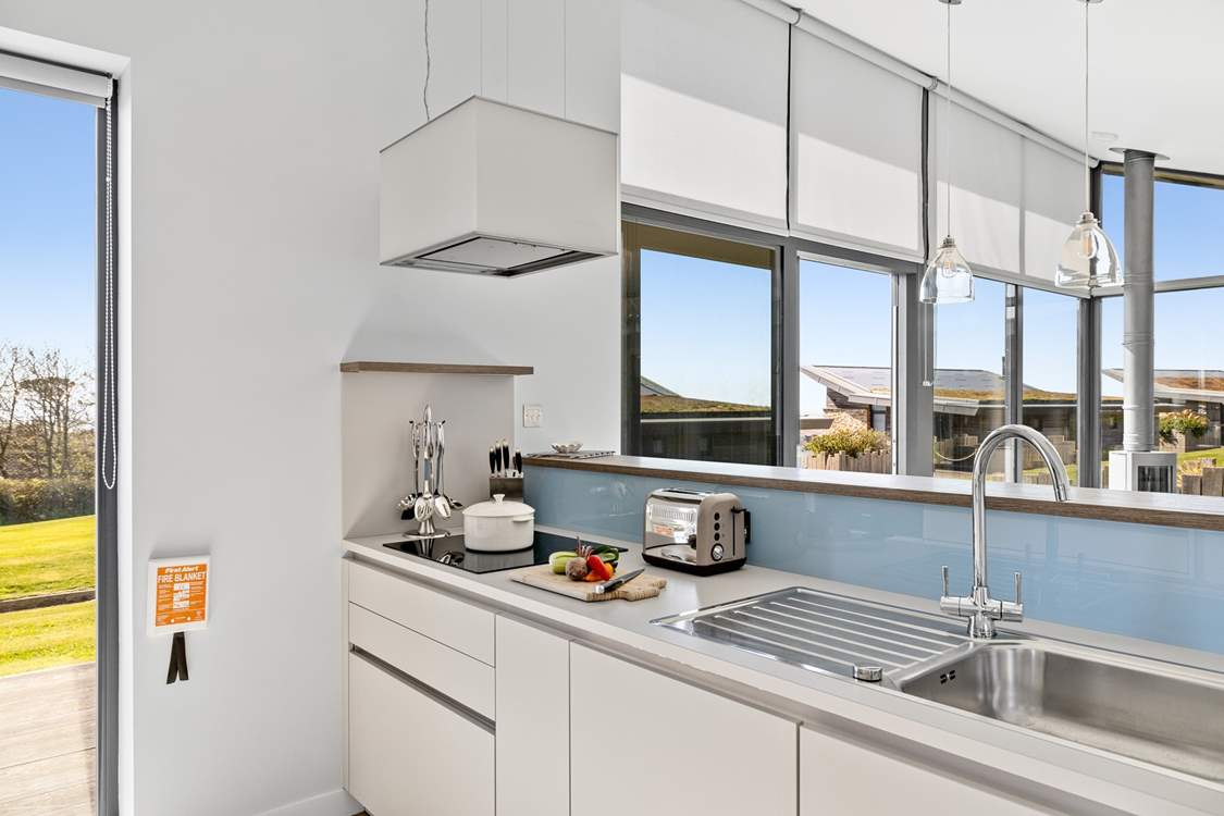 A sleek and fully equipped kitchen awaits your arrival.