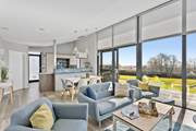 The open plan living area is light, bright and modern.